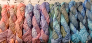 Multi-colored twisted hanks of yarn