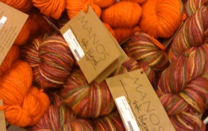 Manos yarn in oranges and brick red
